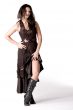 Brunette in brown dress on white background dancing