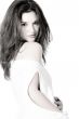 brunette in white shirt on white background high key looking at