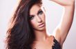 beautiful brunette model in blue blouse and whispering hair