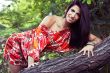 beautiful girl on grass in beautiful and colourful dress