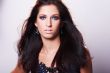 beautiful brunette model in blue blouse and whispering hair