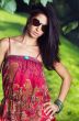 beautiful girl on grass in beautiful and colourful dress