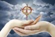 Hands and a cross