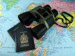 Binoculars, map and travel passports