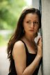 Brunette at a wall