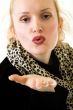 Blowing a kiss