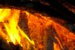 Flaming wooden coal logs