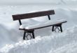 Snowed antique wooden park bench