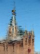 Church Cupola reflected in wavy water