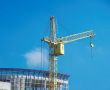 Lifting construction crane at blue sky