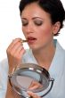 Applying lipstick