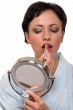 Woman putting on makeup
