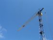 Lifting construction crane at blue sky