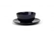 Black bowl on plate