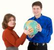 Man and woman hold globe