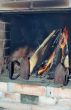 Two old irons in fireplace