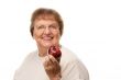 Attractive Senior Woman with Apple
