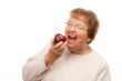 Attractive Senior Woman with Apple
