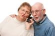 Happy Senior Couple Using Cell Phone
