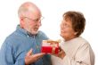 Happy Senior Couple with Gift