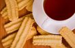 cup of black tea and cookies