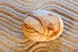 Stone on sand