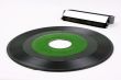 Green record and vinyl brush
