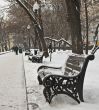 Single bench in winter city park