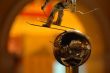 Skier statue over silver ball