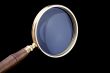 magnifying glass on black closeup