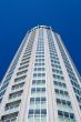 High modern building on background blue sky