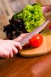 cook cuts tomato