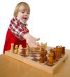 Small girl play chess