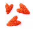 three woollen red hearts