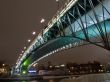 Highlighted bridge over the river at night