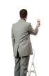 Businessman Painting A Sign