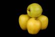 Four yellow apples