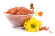 bath salt, oil balls in a bowl and flower