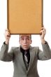 Businessman Holding A Sign