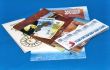 Euro banknotes on maps and booklets