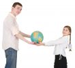 Girl and man hold terrestrial globe