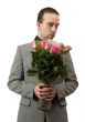 Man Smelling Roses