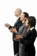 Businesspeople in a row clapping