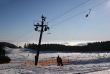 Cable lift with two skiers