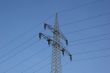 Power line in front of blue sky