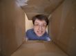 Man portrait inside carton box