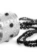 bracelet and black necklace
