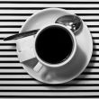 Coffee cup on the striped surface