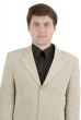Portrait of young businessman in beige suit