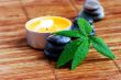 spa stones with leaf and candle